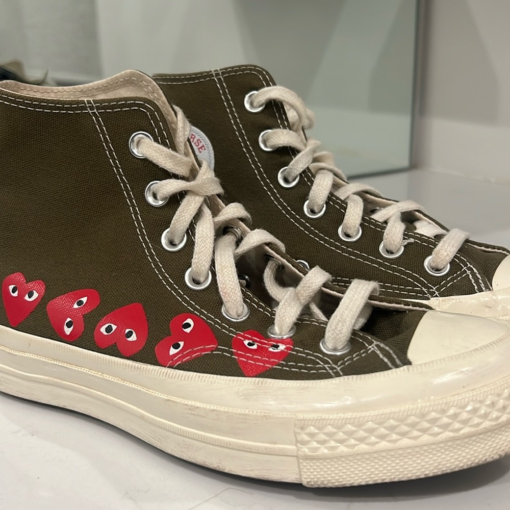 Comme Des Garcons PLAY
x Converse Unisex Chuck Taylor High Top Sneakers